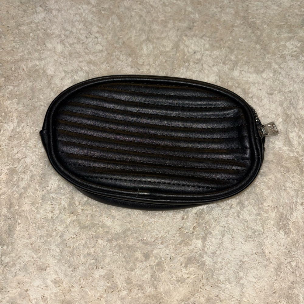 Leather Textured Black Oval Belt Bag with Belt Loops. Gold zipper.